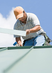 Allen Roofing & Sheet Metal Inc. - Man Installing Metal Roof