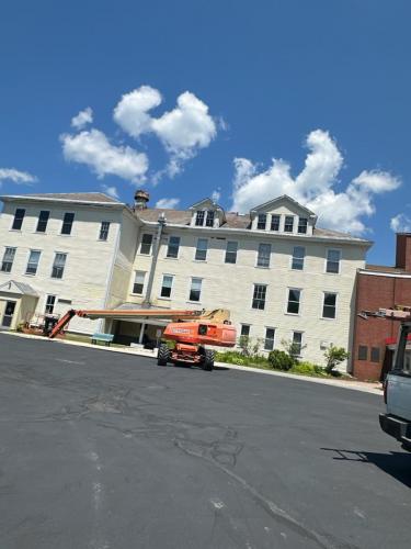 In-progress roofing job on 3-story building